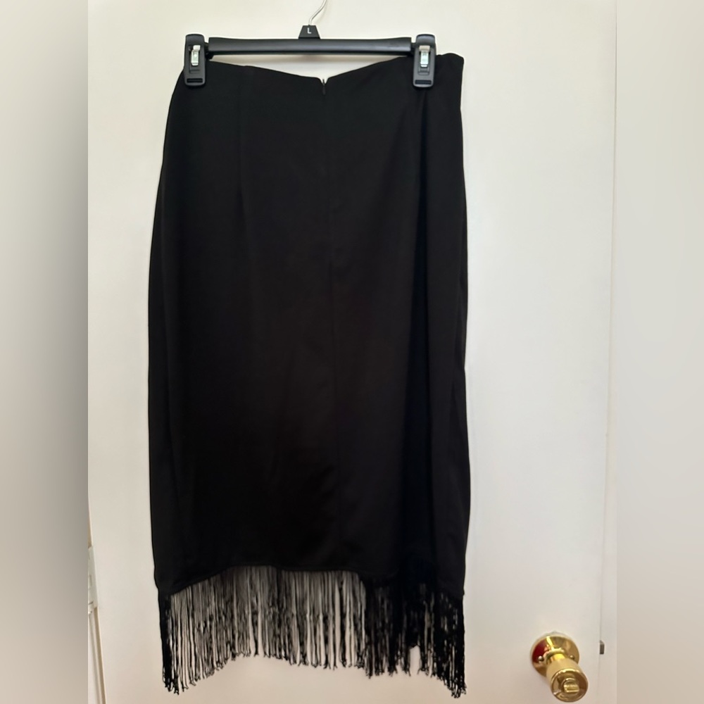 Black skirt with fringe! Size Large! Skirt has a slit. Tag still on it.